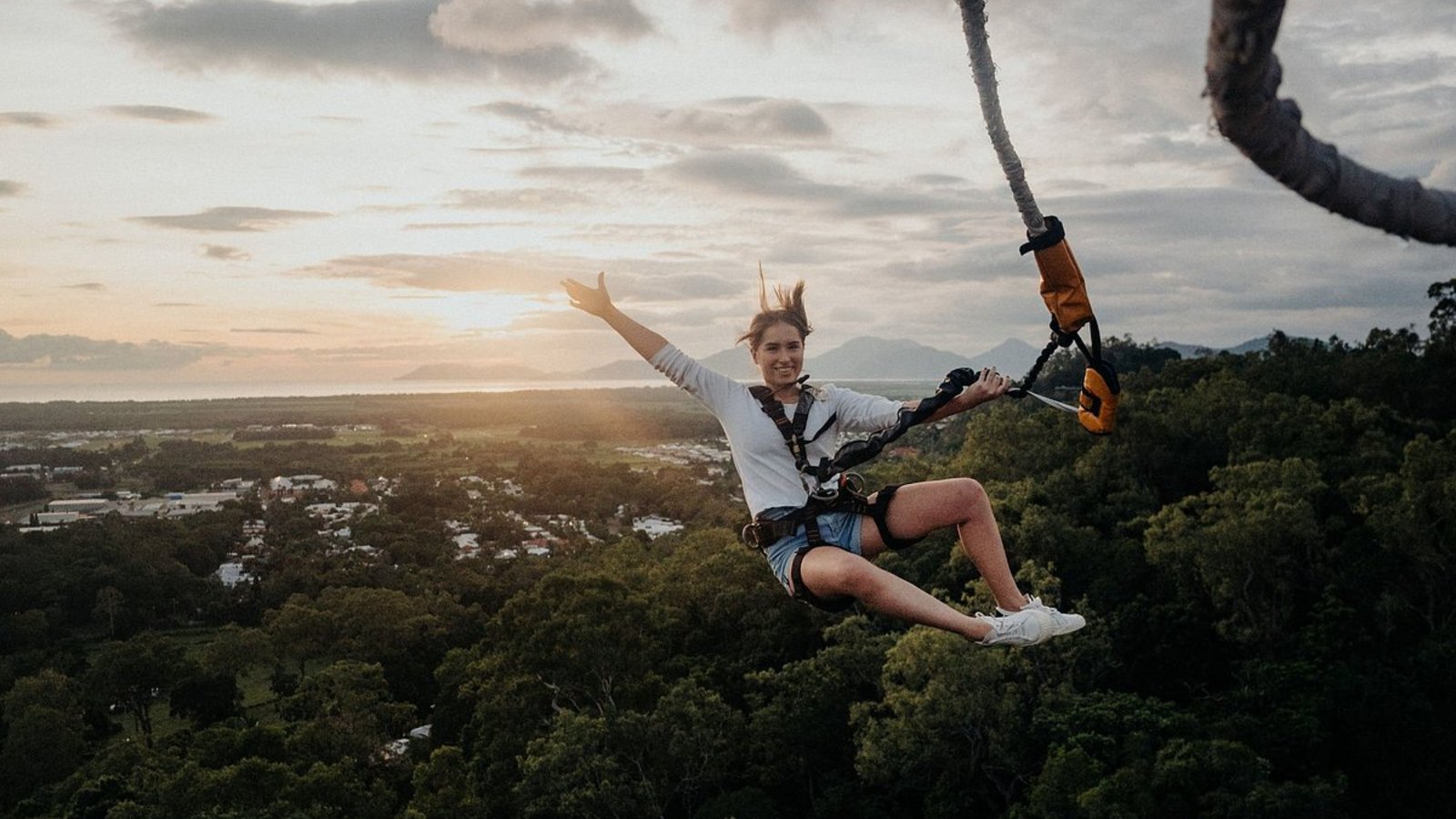 Zipline over the forest at sunset