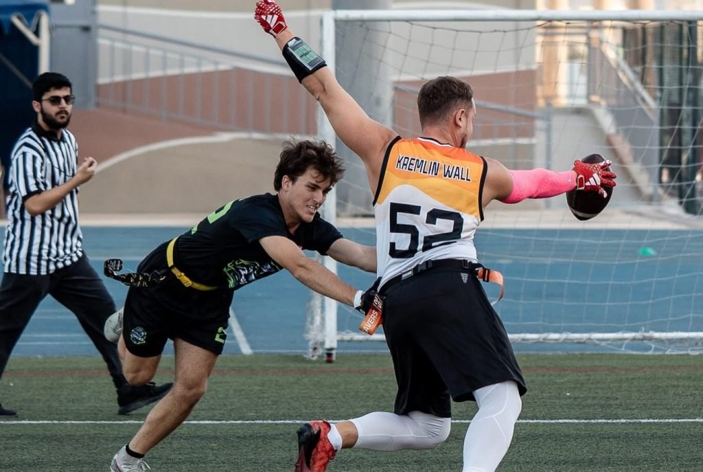 An FFP flag football match, official on the touchline
